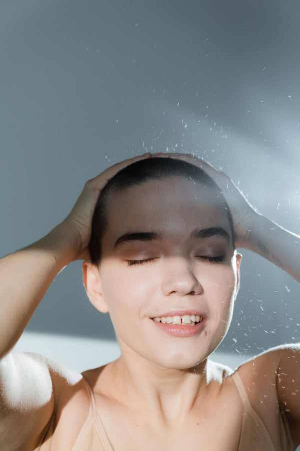 How to Use a Scalp Massage Brush in the Shower